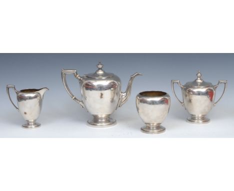 An American Gorham sterling silver four piece tea set, teapot, lidded tea caddy, milk jug and sugar bowl, impress makers mark