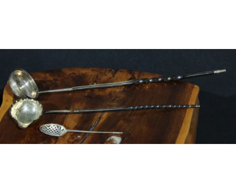 A George II silver mote spoon, the bowl finely pierced with stylized leaves and quatrefoils, the slender handle with pointed 