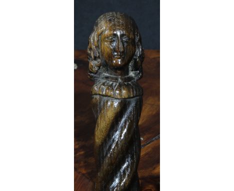 A 19th century oak walking stick, the figural pommel carved with the head of a lady, spirally turned shaft, 90cm long 