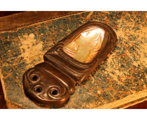 Alfred Lyndhurst Pocock (1882 - 1962), a mother of pearl carving, the head of an Art Nouveau beauty, within a carved wooden c