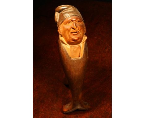Nutcrackers - a Black Forest novelty lever-action nut cracker, carved and painted as a gentleman wearing a tasselled cap, 20.