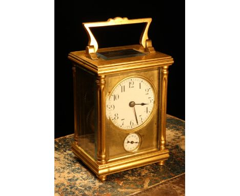 A late 19th century French gilt brass carriage alarm timepiece, 5cm enamel clock dial inscribed with Arabic numerals, above a