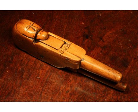Nutcrackers - a 17th century boxwood figural lever-action nut cracker, carved with a primitive face and inscribed Geo. E Holt