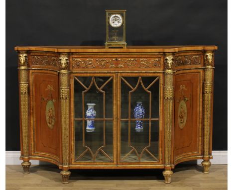 An Adam Revival parcel-gilt satinwood and painted side cabinet, slightly oversailing top above a single frieze drawer and a p