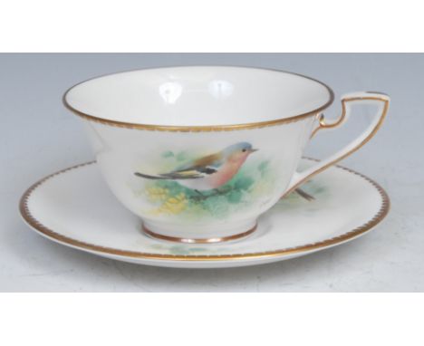 A Royal Worcester teacup and saucer, painted by D. Jones, signed, with a chaffinch and a yellow hammer, 14.5cm diameter, prin