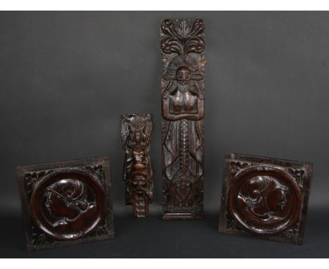 A late 16th century oak term or Atlantis, carved as a bearded gentleman, 53cm high; another, similar, 28.5cm high; a pair of 