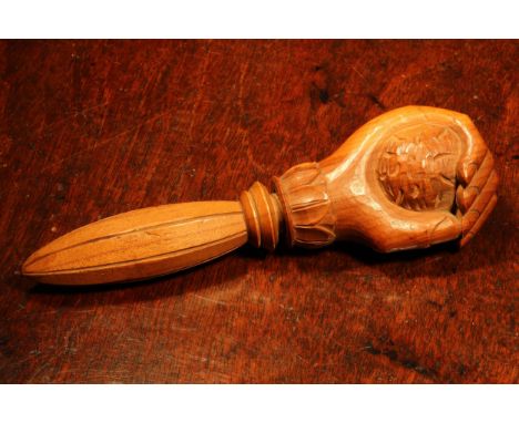 Nutcrackers - a Black Forest novelty screw-action nut cracker, carved as a fist grasping a walnut, lotus grip, 26cm long, c.1