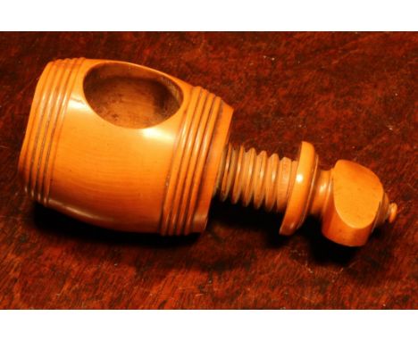 Nutcrackers - an early 19th century boxwood barrel shaped screw-action nut cracker, 8cm high, c.1820 