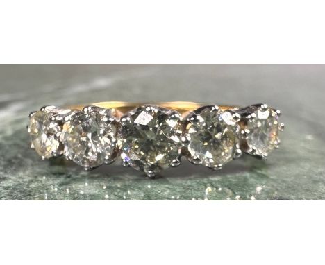 A certified diamond five stone ring, set with five round brilliant cut diamonds, colour J-K-L, clarity VS2-SI1, total diamond