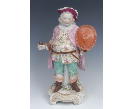A Derby patch mark figure, Quinn as Sir John Falstaff, he stands holding an oval shield, wearing a broad brimmed hat, a doubl