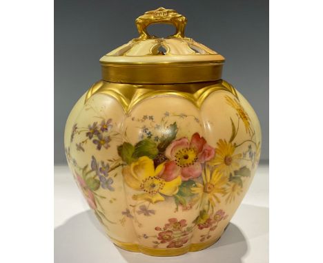 A Royal Worcester Blush Ivory lobed ovoid pot pourri vase and cover, painted with summer flowers on a blushed salmon pink gro