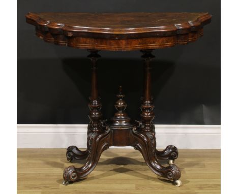 A Victorian walnut and marquetry card table, hinged top enclosing a baize lined playing surface, turned supports, cabriole le