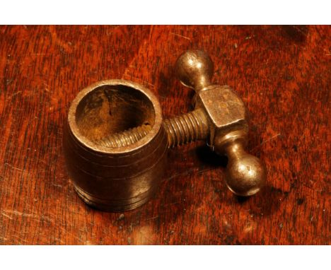 Nutcrackers - an 18th century steel barrel shaped screw-action pocket nut cracker, 3cm wide, c.1750 - 1780 