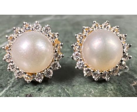 A pair of diamond and cultured pearl cluster earrings, central white cultured pearl surrounded by sixteen round brilliant cut