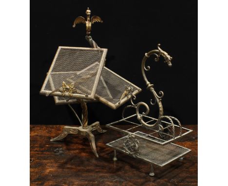 An unusual early 20th century brass periodical stand, wyvern finial above an asymmetrical arrangement of three mesh tiers, tr