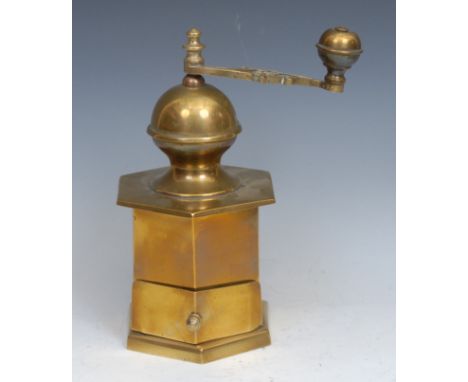 A 19th century hexagonal brass coffee mill or grinder, scrolling articulate handle, drawer to base, 24cm high 