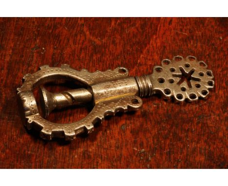 Nutcrackers - a 17th century steel screw-action nut cracker, the shaped thumbpiece drilled and pierced with a six-pointed sta