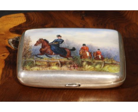 A Victorian silver and enamel rounded rectangular cigarette case, hinged cover decorated in polychrome with a hunting scene, 