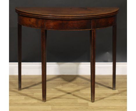 A George III mahogany demilune card table, outlined throughout with boxwood stringing, tapered square legs, 73cm high, 89cm w