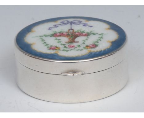 An early 20th century silver and guilloche enamel circular snuff box, hinged cover decorated with a ribbon-tied basket of flo