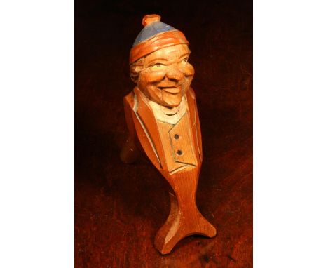Nutcrackers - a Black Forest novelty lever-action nut cracker, carved and painted as a gentleman wearing a bobble hat, 19cm l