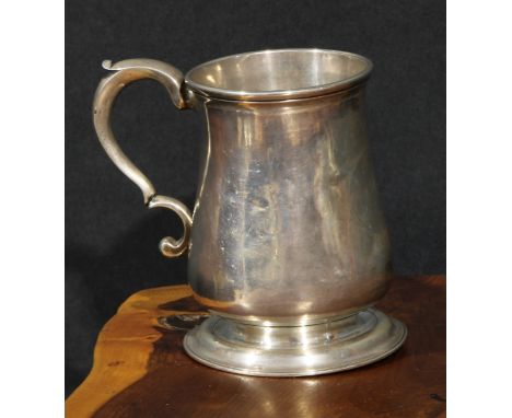 An early George III provincial silver bell shaped half pint mug, scroll-capped handle, skirted base, 10cm high, John Langland