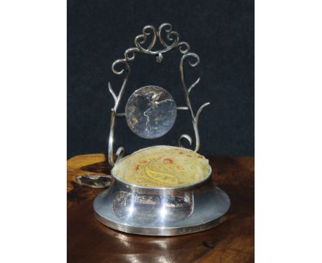 A late Victorian silver combination pocket watch stand, ring tree and pin cushion, spreading circular base, 11.5cm high, Birm