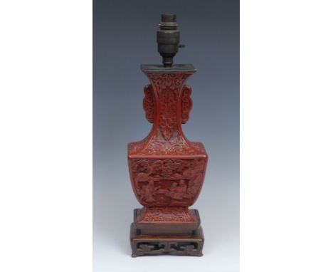 A Chinese cinnabar gu shaped vase, mounted as a table lamp, 31cm high under fitting, the fittings early 20th century 