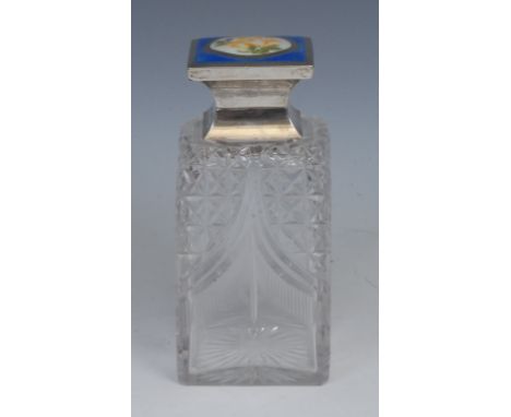 A George V silver and guilloche enamel mounted square hobnail-cut glass perfume bottle, hinged cover decorated with a yellow 