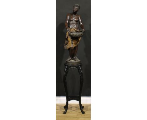 A large Goldscheider painted terracotta figure, of an African attendant, she stands holding a basket, 93cm high, impressed ma
