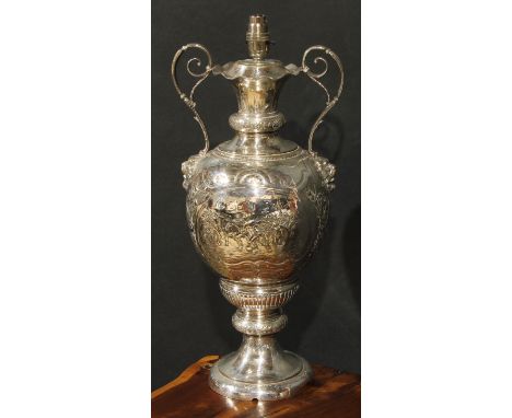 A large Victorian E.P.N.S ovoid pedestal lamp, formerly a vase of Scottish sporting interest, chased with a football match wi