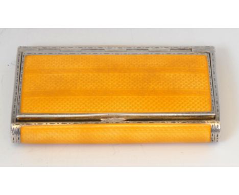 A Continental Art Deco silver and canary yellow guilloche enamel snuff box, hinged cover, gilt interior, 8cm wide, import mar