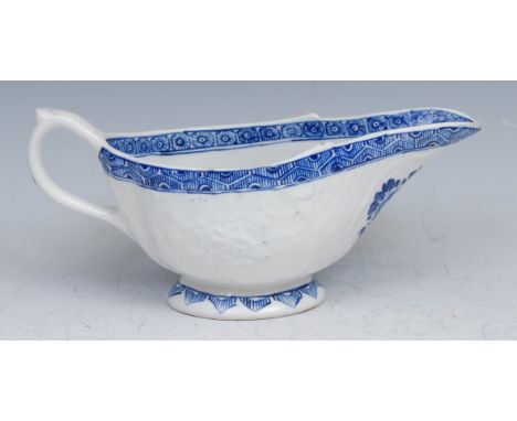 A Derby patch mark sauceboat of unusual shape, moulded with panels of raised flowers surrounded by basketweave moulding, pain