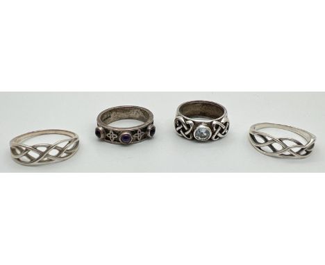 4 silver Celtic design band style rings. One set with a single round cut blue topaz and another set with 3 round cut amethyst