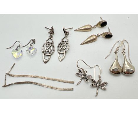 6 pairs of silver and white metal drop style earrings for pierced ears. To include Celtic knot design, dragonflies and vintag