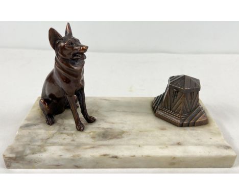 An Art Deco design marble based standish desk stand with spelter dog figure and stylised inkwell with hinged lid (no liner). 