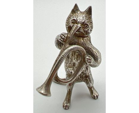 An Edwardian silver novelty container modelled as a cat playing the bugle, with hinged head. Import hallmarks on tail for Lon