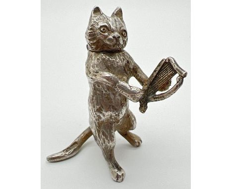 An Edwardian silver novelty container modelled as a cat playing a lyre/harp, with hinged head. Import hallmarks on tail for L