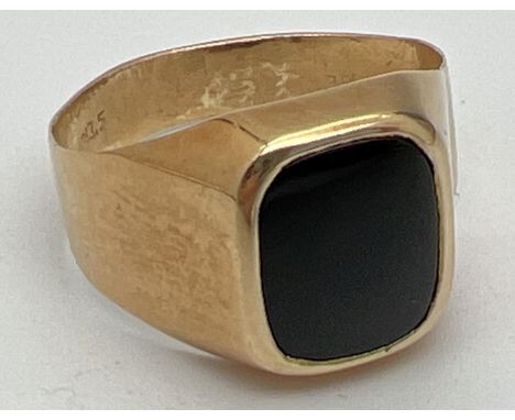 A men's 20ct gold and black onyx signet ring, band slightly misshapen. Stamped 83.5 inside band. Ring size VÂ½. Total weight 
