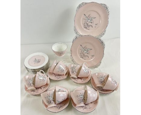 A vintage "Dawn Flight" teaset by Royal Grafton. Pale pink with black and white water fowl decoration and silver rims. Compri