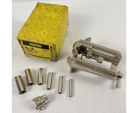 A vintage Stanley tools No.59 doweling jig, in unused condition. Complete with 6 guides and original box. 