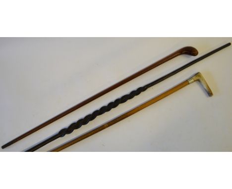 An African carved ebony walking cane with flattened pommel top and triple-twist stem, to/w another walking cane carved from a