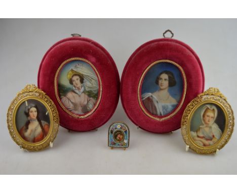 Two pairs of 20th century continental oval portrait miniatures on ivory of artistocratic ladies, two in ornately pierced gilt