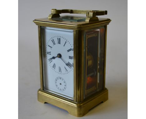 A brass carriage clock with alarm action striking on a bell, 12 cm high Condition Report ticking - no damage