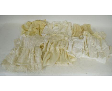 A cream fine wool infant's cloak, an embroidered cream silk christening gown, an embroidered cotton example, two lace-edged b