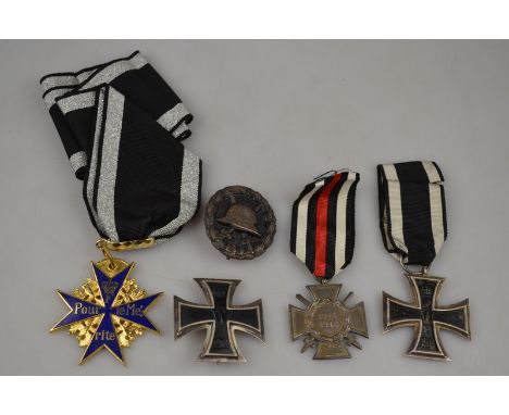 World War I Imperial German Army Iron Cross 1st Class (silver, pin type); Iron Cross 2nd class; 1914/18 Service cross, a woun