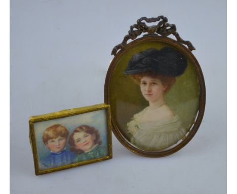 An early 20th century German oval portrait miniature on ivory of a young lady with blue feather hat and white dress, signed '