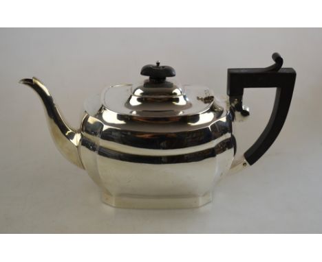 An oblong silver teapot with composite handle and finial, Joseph Gloster Ltd, Birmingham 1924, 17.9 oz gross