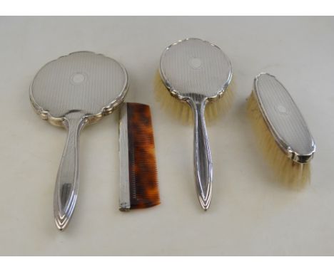 An engine-turned silver four-piece brush and comb set including hand-mirror, Adie Bros., Birmingham 1955/56 Condition Report 