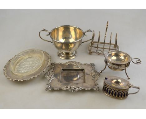 A two-handled silver sugar basin on stemmed foot, Birmingham 1933, a lancet toast rack, Goldsmiths & Silversmiths Co. Ltd., S